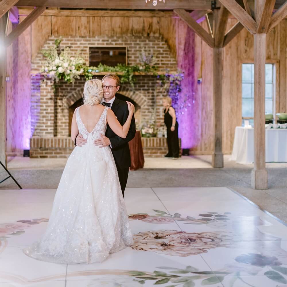 Dining table decorated with candles, flowers, and classic tableware.
