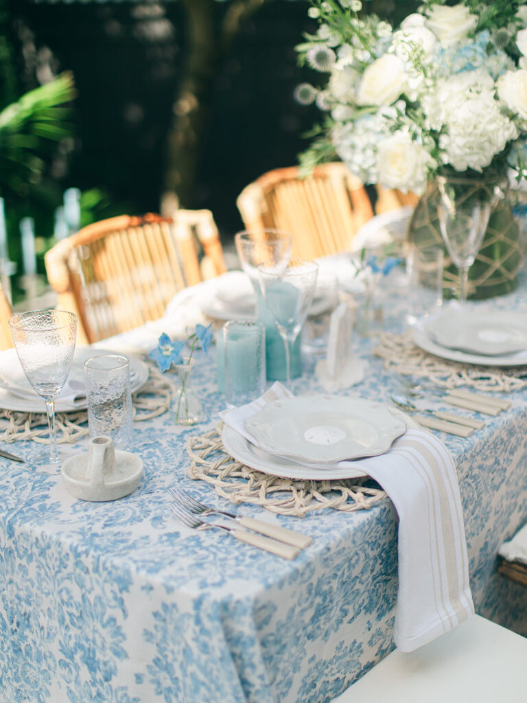 White wooden chair with slatted back for event seating.