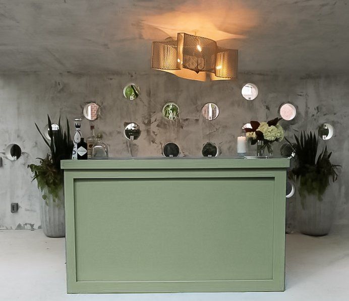 Sage green bar ideal for outdoor weddings.