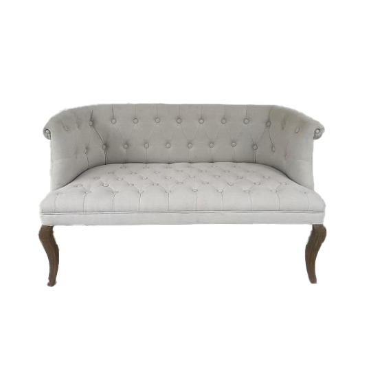 White upholstered sofa with pillows for lounge seating.